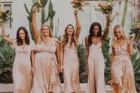 delicate mismatching satin blush midi and maxi bridesmaid dresses are great for a spring or summer wedding