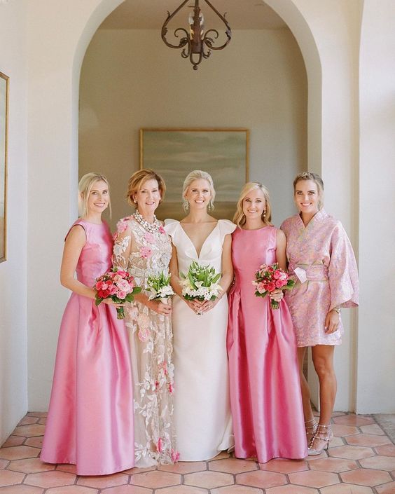 elegant sleeveless pink bridesmaid maxi dresses with high necklines and pleated skirts are amazing for a chic formal wedding