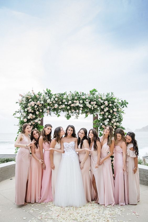 light and pale pink draped maxi bridesmaid dresses with slits and various necklines are great for a spring or summer wedding