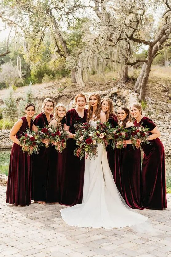 lovely mismatching burgundy velvet maxi bridesmaid dresses are a perfect solution for a fall wedding