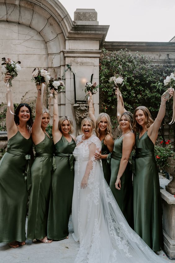 matching green satin maxi bridesmaid dresses with spaghetti straps and sashes are great for summer and fall