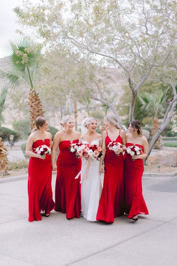mismatched red maxi bridesmaid dresses are a super cool idea for a holiday or Christmas wedding