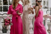 mismatching bright pink maxi bridesmaid dresses are a nice solution for a bold wedding with pinks