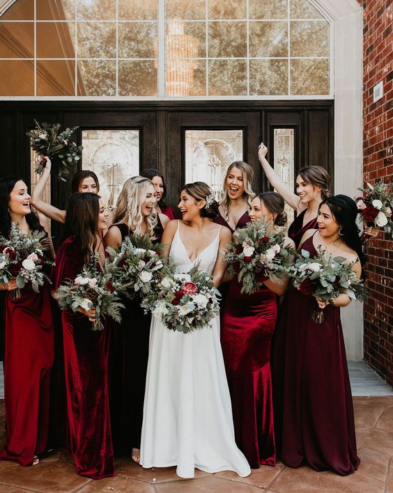 mismatching burgundy velvet maxi bridesmaid dresses are perfect for a fall or winter wedding, they look very chic