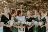 mismatching green and dark green velvet and satin bridesmaid dresses are great for a winter wedding