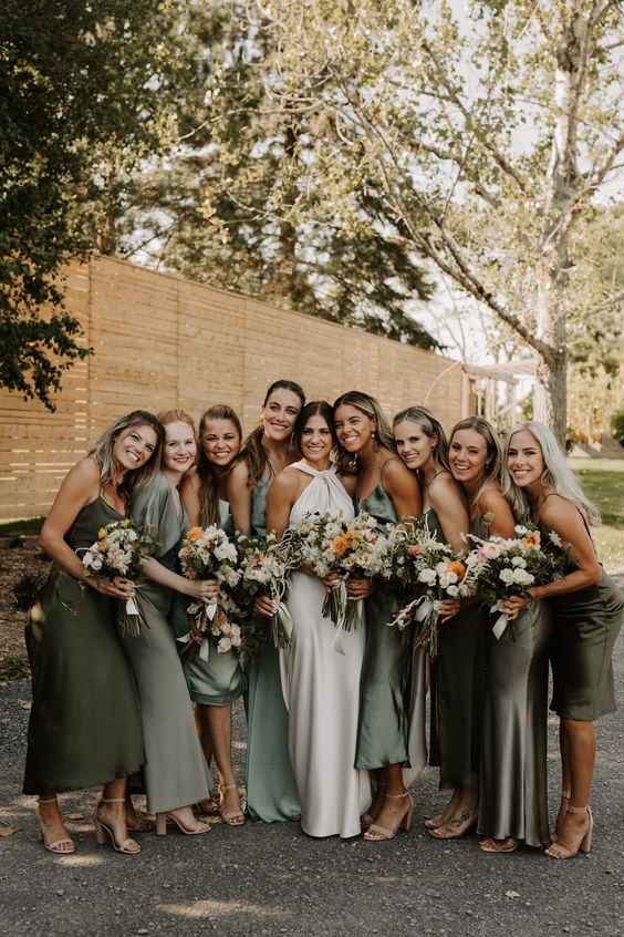 mismatching green, sage green and olive green midi and maxi bridesmaid dresses for a neutral wedding