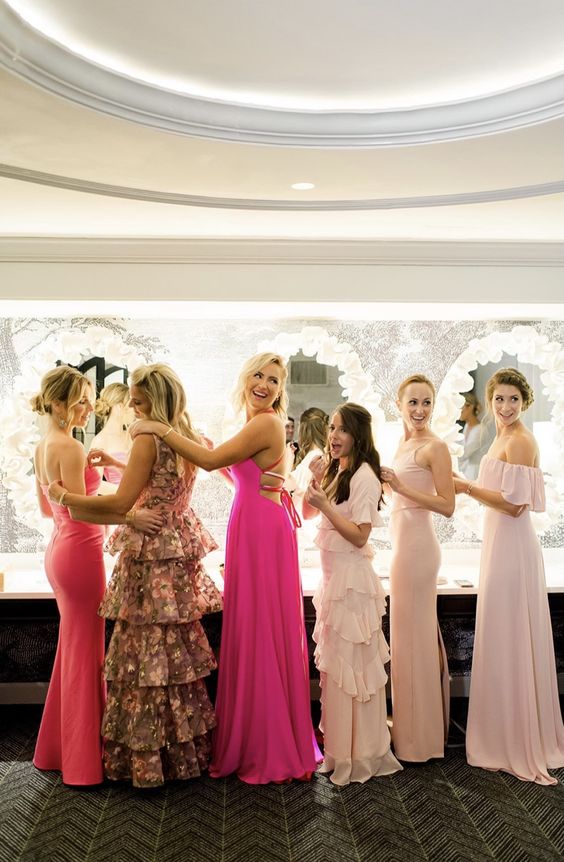 mismatching hot pink, pink and blush maxi bridesmaid dresses with various details are amazing for summer