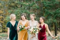 mismatching jewel tone bridesmaid dresses of velvet – an emerald, burgundy and mustard one are fantastic for a fall wedding in bright shades