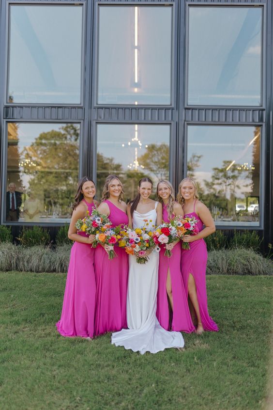 mismatching maxi hot pink bridesmaid dresses are a hot idea for summer, for a colorful wedding