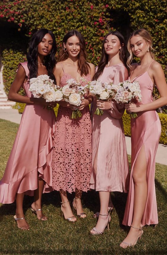 mismatching pink midi bridesmaid dresses of satin and lace are a cool and chic idea for spring and summer weddings