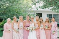 mismatching pink plain and floral maxi bridesmaid dresses are a chic idea for a spring or summer weddings