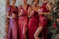 mismatching red and pink maxi bridesmaid dresses with slits are a super chic idea for a Christmas wedding