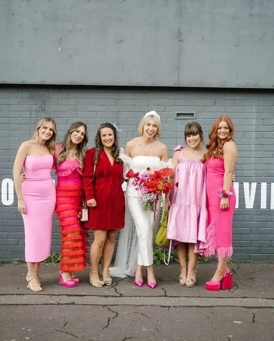 mix and match light pink, hot pink and red short and midi bridesmaid dresses for a bright modern wedding
