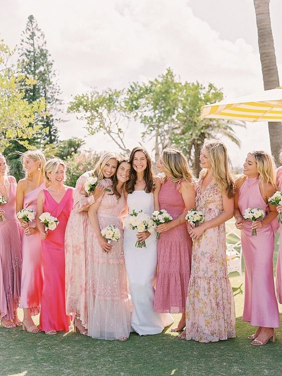mix and match pink plain and floral midi and maxi bridesmaid dresses are a cool idea for a spring or summer wedding