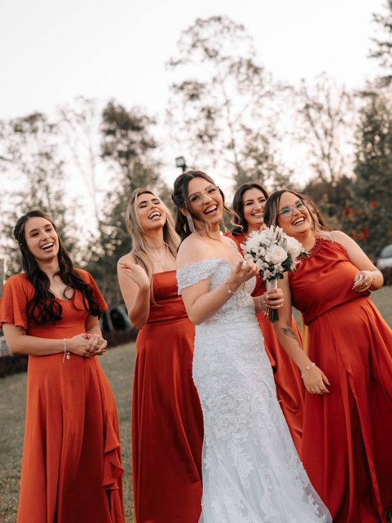 mix and match red maxi bridesmaid dresses are a cool idea for a fall or winter wedding