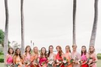 mix and match red, pink, peachy pink, mauve and yellow bridesmaid dresses are adorable for a colorful wedding