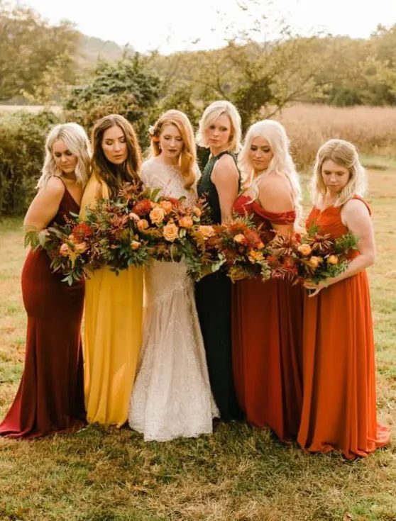 mustard, burgundy, orange, rust and dark green mismatching plain and lace maxi bridesmaid dresses are amazing for a fall wedding