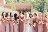 pale pink, blush and mauve maxi mermaid bridesmaid dresses with various necklines but a cohesive look