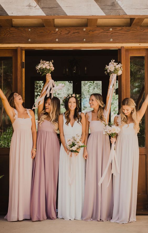 pale pink, pink and blush maxi bridesmaid dresses with pleated skirts and ruffle straps for a spring wedding