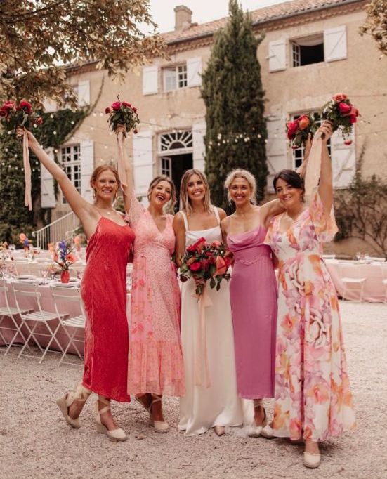 pink, blush and a deep red printed midi birdesmaid dresses are a cool idea for a colorful summer wedding
