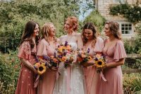 pretty mix and match pink maxi bridesmaid dresses with short sleeves and pleated skirts for a summer garden wedding