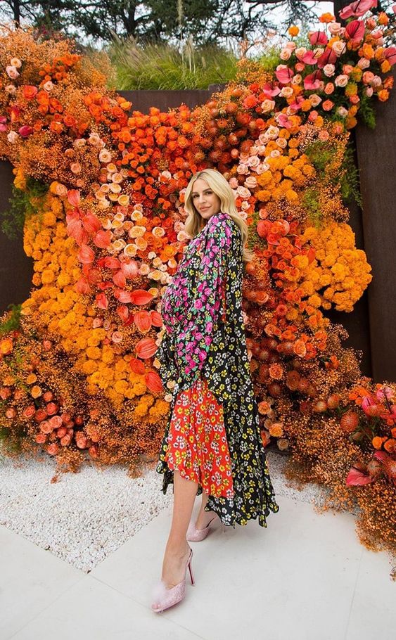 a jaw-dropping colorful floral wall is a timeless idea for tying the knot and as a photo booth backdrop, too