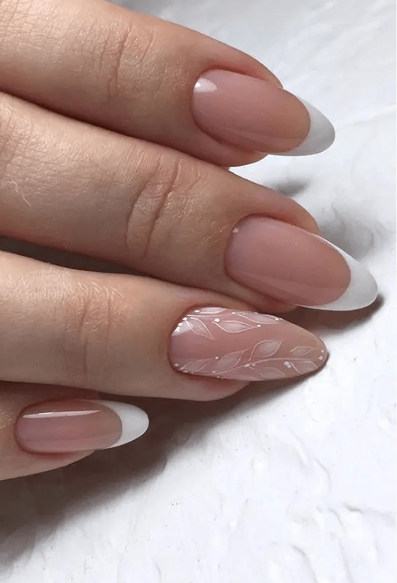French nails with a delicate accent nails with painted leaves are adorable for a bridal look