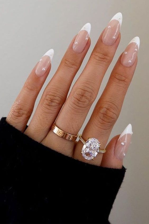a French manicure with some pearls looks very sophisticated, chic and extremely beautiful