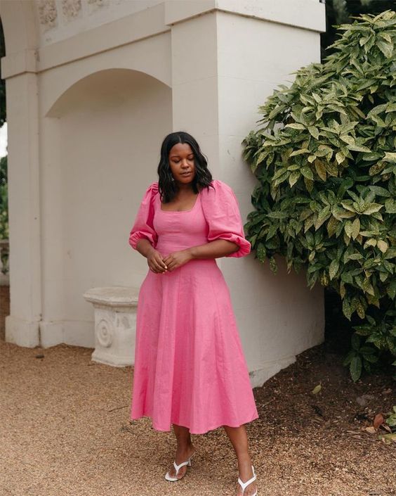 a beautiful pink linen midi dress with a square neckline and puff sleeves, white flipflop heels for a bridal shower