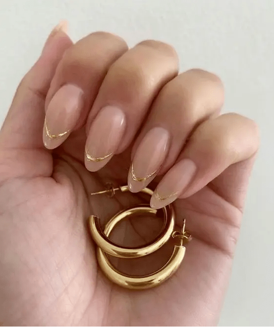 a chic and glam French wedding manicure with a gold touch is a lovely idea to look chic and wedding-appropriate