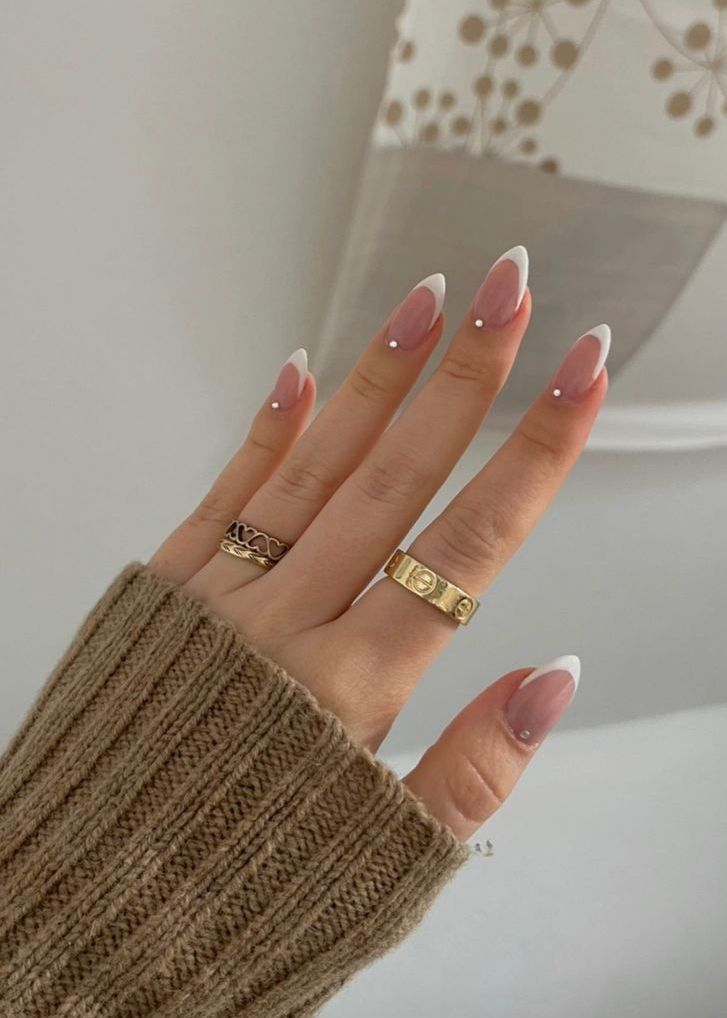 a classy French wedding manicure accented with little rhinestones is a cool and chic idea suitable for most bridal looks