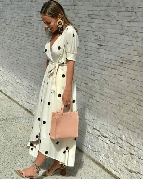 a creamy polka dot wrap mixi dress with short sleeves, blush printed shoes and a blush bag plus statement earrings