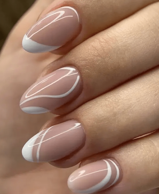 a fresh take on French manicure with white swirls and tips, is a very stylish and ultra-modern idea