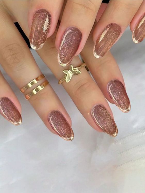 a glam and shiny French manicure with dusty pink velvet and gold tips is amazing for a wedding