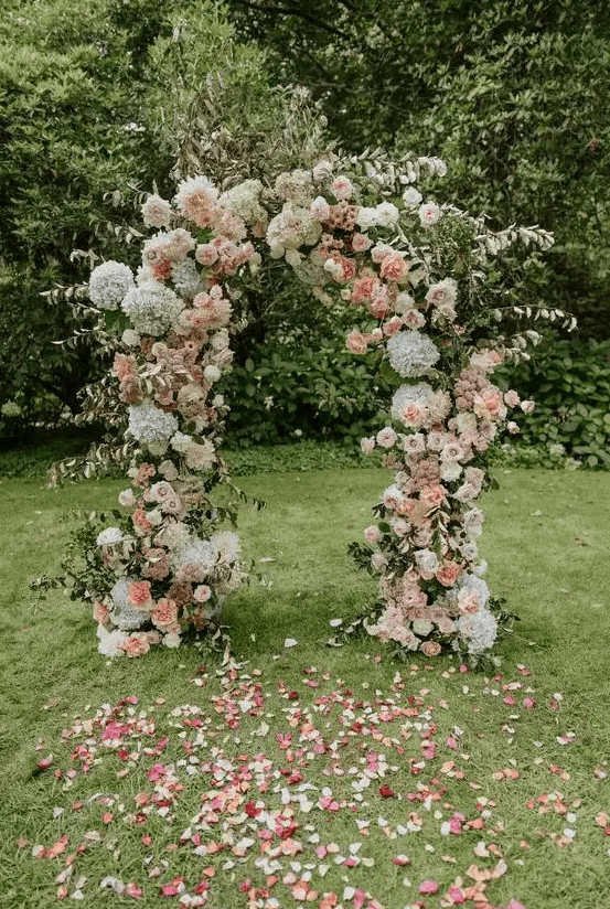 a lush summer wedding arch