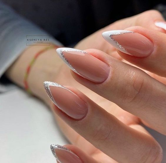 a pointed French manicure with silver glitter touches is a beautiful and chic idea to realize for a wedding