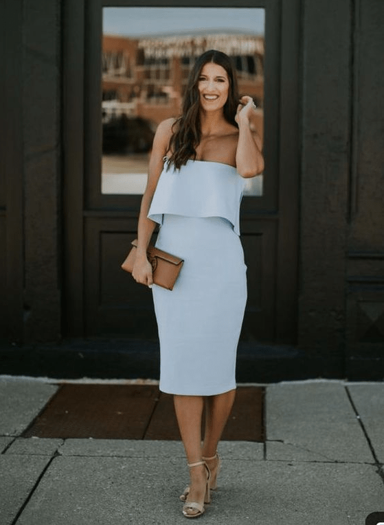 a strapless pale blue midi fitting dress, nude heels and a brown clutch for a spring wedding