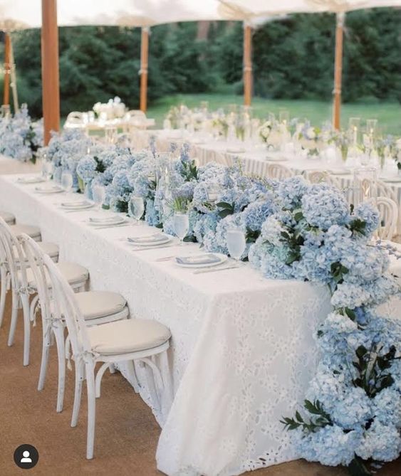 a super lush blue hydrangeas table runner with greenery is a catchy solution for spring or summer