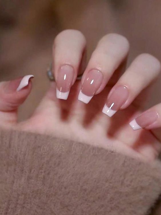 an eye-catchy ombre French manicure will be a nice fit not only for a bride but for every person who likes neutral manicures