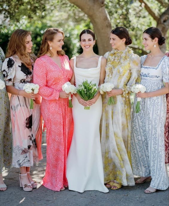 colorful mismatched maxi bridesmaid dresses with various prints are a cool idea for an eclectic wedding