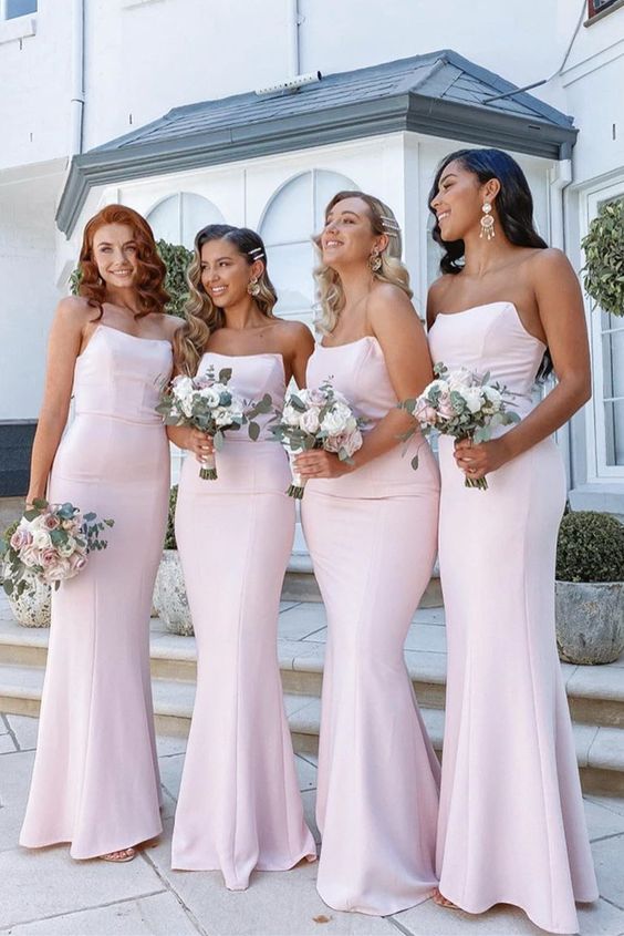elegant light pink strapless mermaid bridesmaid dresses are a great idea for a spring or summer wedding with pink in the color palette
