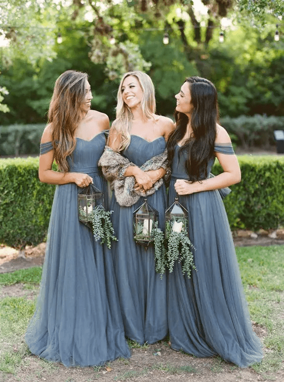 graphite grey off the shoulder maxi bridesmaid dresses with draped bodices, pleated skirts and sashes are chic