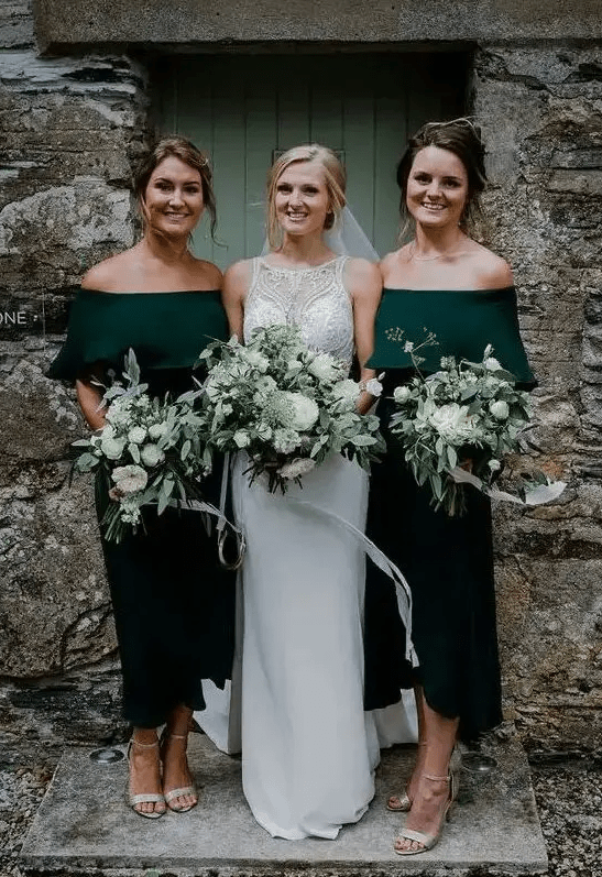 hunter green off the shoulder midi bridesmaid dresses and silver shoes plus green and white wedding bouquets
