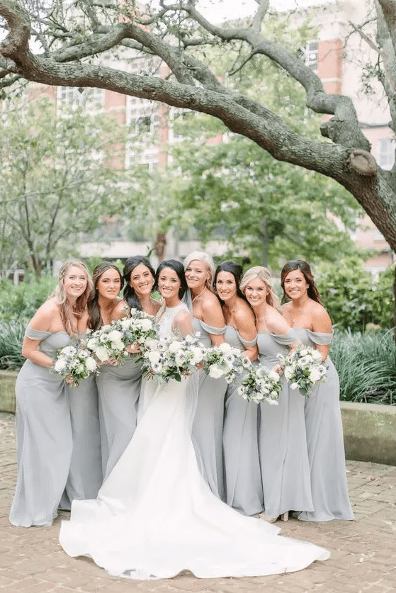 matching dove grey off the shoulder maxi bridesmaid dresses are chic and cool for a spring or summer wedding