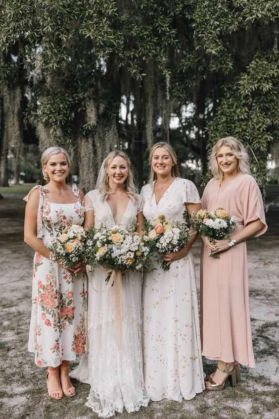 mismatched midi and maxi bridesmaid dresses in white and blush, with various prints and lace are awesome