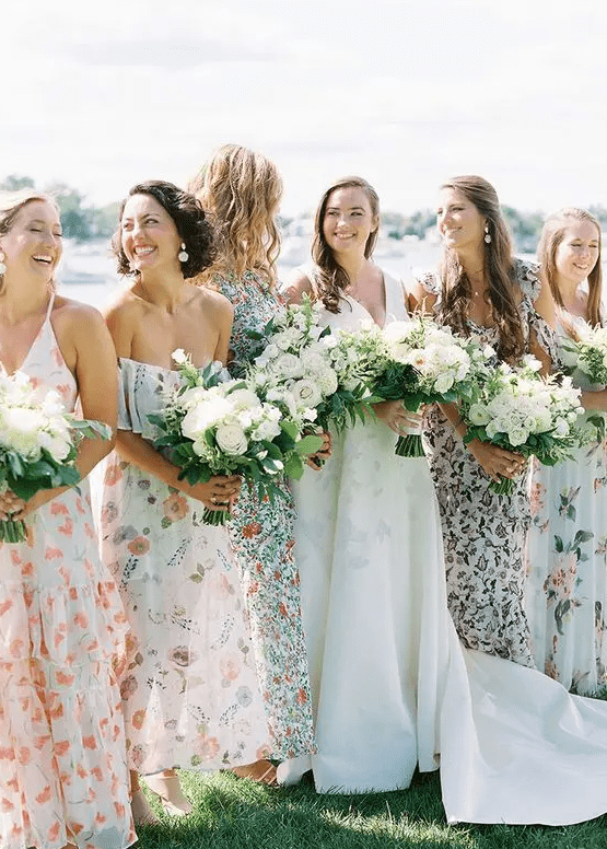 Mismatched neutral floral midi and maxi bridesmaid dresses are great for a flower filled wedding
