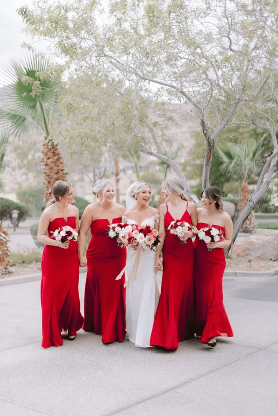 mismatched red maxi bridesmaid dresses are a super cool idea for a holiday or Christmas wedding