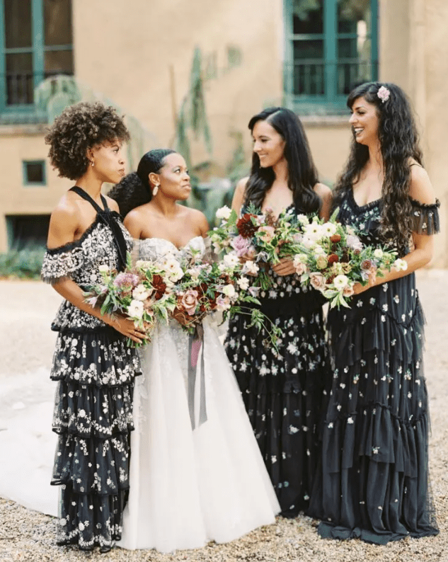 mismatching black floral maxi bridesmaid dresses with various designs are amazing for a fall wedding