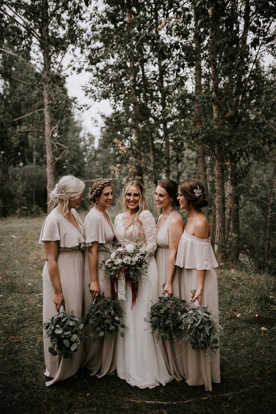 neutral strap and off the shoulder maxi bridesmaid dresses are a lovely idea for a boho summer wedding