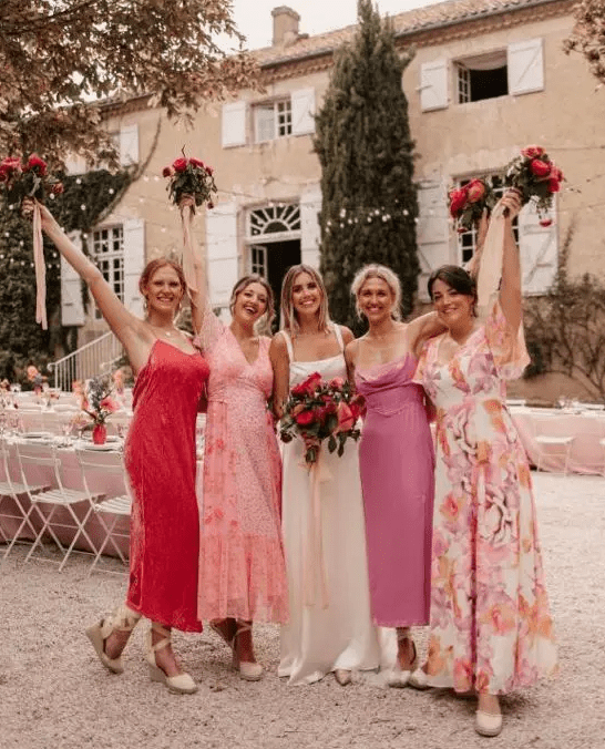 pink, blush and a deep red printed midi birdesmaid dresses are a cool idea for a colorful summer wedding